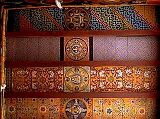 Tibet Guge 06 Tsaparang White Temple 10 12 Jowo Khang Ceiling The roof of the temple may also be considered as the richest and most finely worked out in the whole of Western Tibet.  It is made of large wooden planks, brought with great labour from the Himalayan valleys towards India, well smoothed and then painted. Their decoration consists in a series of mandalas, all on the same axis, and of stylized floral and geometric motifs, never repeating themselves. - Giuseppe Tucci: The Temples of Western Tibet and their Artistic Symbolism (1935). Photo  